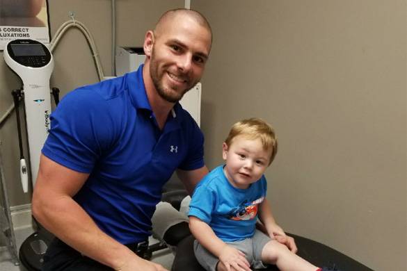 Chiropractor Scott LA Dustin Pelloquin With Kid